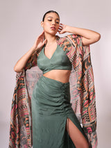 Multi colored geometric print cape, chalk green blouse and skirt set